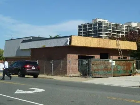 A building that is under construction on the side of the road.